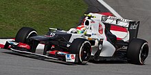 Photo de Pérez pilotant sa Sauber C31 de 2012 lors des qualifications du Grand Prix de Malaysie 2012.