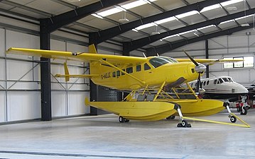 The water rudders on this Cessna 208 Caravan floatplane are the small vertical surfaces on the rear end of each float. Their setting is controlled from the cockpit.