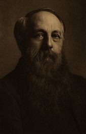 Photo en couleur de Henry Hyndamn, il porte une barbe