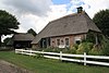 Boerderij onder rieten wolfsdak