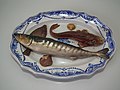 Palissy majolica c. 1880. Platter is opaque white tin-glazed with cobalt oxide brush-painted decoration, and the applied fish are of coloured glazes majolica.
