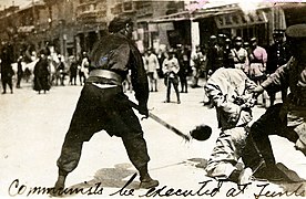 Public beheading of a communist during Shanghai massacre of 1927.jpg