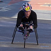 A photo of Tatyana McFadden, in her wheelchair during a road race