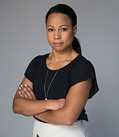 Alice Bah Kuhnke crossing her arms in front of her in a studio setting