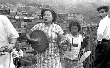 A blind Taiwanese woman playing the southern style long-necked yueqin