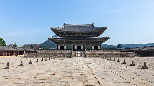 Front view of the Imperial Throne Hall Geunjeongjeon at Gyeongbokgung Palace with blue sky in Seoul