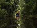 A boat coming towards a canal tunnel