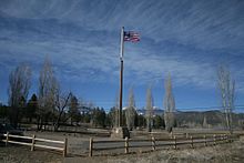 Flagpole in a field