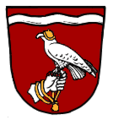 Gemeinde Gennach In Rot unter silbernem Wellenbalken eine silberne behandschuhte Hand, darauf sitzend ein rotbewehrter silberner Falke mit goldener Kappe.