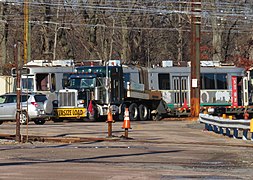 MBTA 3711 and lowboy trailer in Riverside Yard, December 2018.JPG