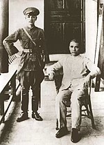 Sun Yat-sen is seated with Chiang Kai-shek to his left.