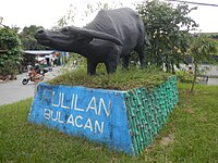 Kneeling Carabao Statue in Longos