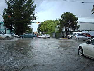 Cars crossing a street after a normal rain in north Mexico, 2007.