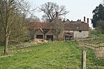 High Down House with Buildings and Walls around Courtyard on North Side