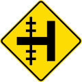 (W15-1.1/PW-13.1) Railway level crossing on side road to left