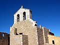 Vista frontal (occidental) de la iglesia de la Trinidad en Moya (Cuenca), con detalle de la espadaña, tras su restauración.