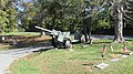 Howitzer at cemetery entrance.