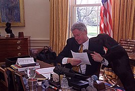 Photograph of President William Jefferson Clinton on the Phone with Russian President Boris Yeltsin While Buddy the Dog is in the Room- 04-04-1998 (6461530801).jpg