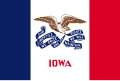 The flag of Iowa, a charged vertical triband.