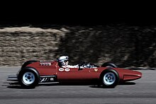 John Surtees drives a Ferrari 158 at Goodwood