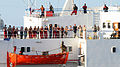 Image 66The crew of the merchant vessel Faina stand on the deck after a U.S. Navy request to check on their health and welfare. The Belize-flagged cargo ship owned and operated by Kaalbye Shipping, Ukraine, was seized by pirates 25 September 2008 and forced to proceed to anchorage off the Somali coast. The ship was carrying a cargo of Ukrainian T-72 tanks and related military equipment. (from Piracy off the coast of Somalia)