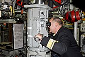 Rear Admiral Bernt Grimstvedt, chief of the Royal Norwegian Navy, looks through the periscope during a port visit to strengthen maritime partnership with Norwegian counterparts. (11 October 2011)