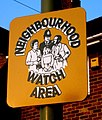 A British Neighbourhood Watch sign affixed to a lamppost.