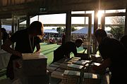 Workers prep books for signing at the bookstore