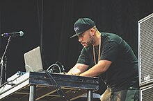 Simmons performing in 2016