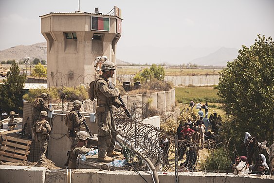 U.S. Marines assist with security at an Evacuation Control Checkpoint during an evacuation at Hamid Karzai International Airport, Kabul, August 20.