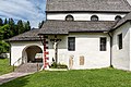 English: Crucifix, romanesque gravestone with inscription "WLVERS" and pre romanesque carved stone (resurrection symbol?) with blessing cross at the exteriour southern wall Deutsch: Kruzifix, romanische Grabplatte mit Inschrift „WLVERS“ und vorromanischer Ritzstein (Auferstehungssymbol?) mit Weihekreuzchen an der südlichen Außenwand