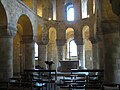 The smaller arches at the lower level are stilted to match the wider arches on the left (St John's Chapel, London)