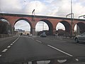 Image 30Old meets new at the Stockport Viaduct; designed by George W. Buck, it is the largest free-standing brick structure in the UK, built in 1840 when it was the largest viaduct in the world; it features in many L. S. Lowry paintings. (from North West England)