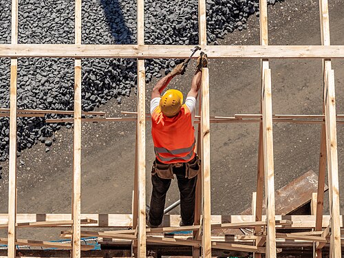 Carpenter working on a concrete formwork