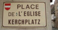 Stroßeschild àm Kerchplàtz z Änse