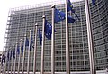 The EU flags in front of the main office of the European Commission.