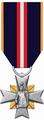 Odznaka Świętego Floriana „Za Zasługi dla Społeczności Lokalnej”. – awers.