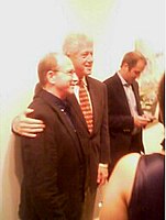 Saltz and Bill Clinton pose at an art gallery exhibit opening—side view of the scene long used as the user-avatar on Saltz's official Facebook page