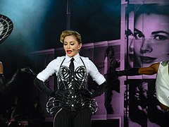 Madonna on the MDNA Tour, the most recent of her three that achieved highest-grossing tour-of-the-year