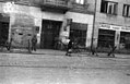 Bunker and gate of Abschnittwache Nord (so called Nordwache) building at Żelazna 75a street behind barbed wire obstacles “Cheval de fries” July 1944