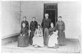 A Latter Day Saint with five wives and his mother (posed on porch) LCCN2003663781.jpg