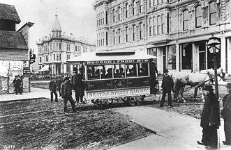English: Seattle's first streetcar, 1884, corner of Occidental & Yesler.