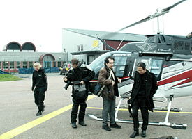 Photographers about to embark a helicopter, 2013