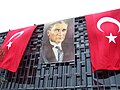 Big Turkish flags and portrait of Atatürk mounted on Atatürk Kültür Merkezi