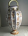 Minton tin-glazed Majolica vase, 'grotesque' Renaissance style, 'MINTON' to the neck, mostly flat surfaces, opaque white glaze, brush painted.