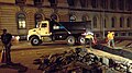 Image 14Construction crew laying down asphalt over fiber-optic trench, in New York City (from Road surface)