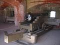 Original 32-pounder gun on reproduction carriage in Casemate 29.