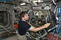 Michael Barratt uses a computer near the Microgravity Science Glovebox (MSG)