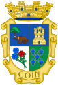 Coín: insigne