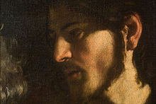 Détail d'un tableau : visage d'un homme barbu tourné vers la gauche, clair-obscur.